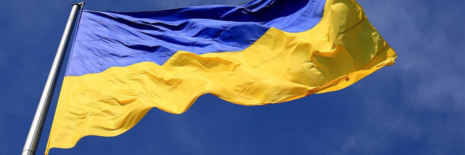 Ukraine flag against blue sky