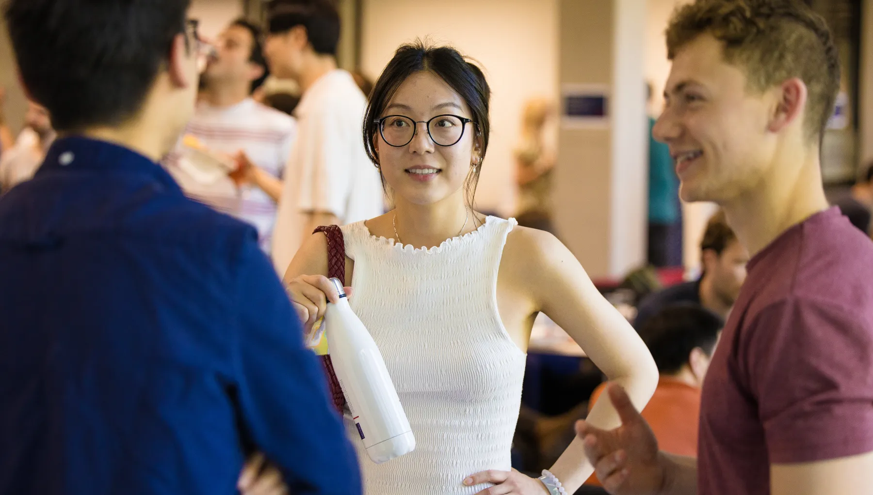 image of a group of students standing talking
